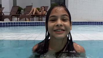 8/9yo brazilian girl having fun in pool
