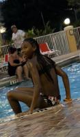 Candid shots of black teen girl poolside