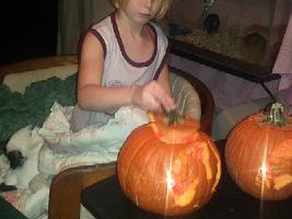girls carving pumpkins